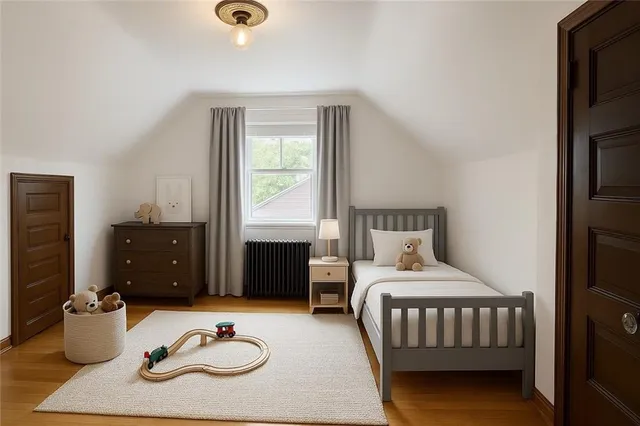 a bedroom with furniture and a wooden floor