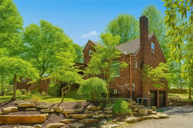 a backyard of a house with lots of green space