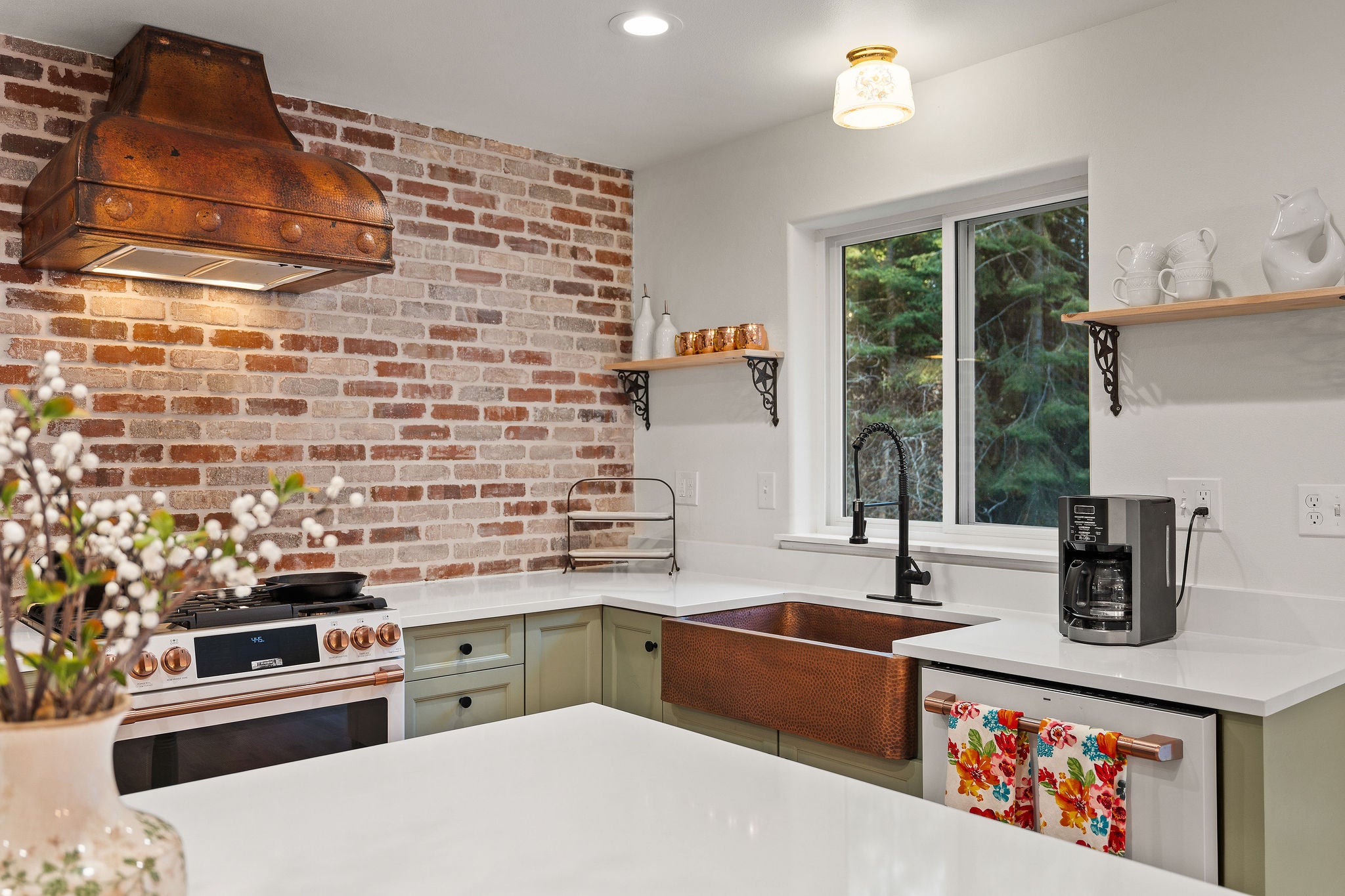 620 Swan River Road Bigfork, MT 59911 - Photo 10 of 50 Striking brick backsplash with stunning copper range hood and sink