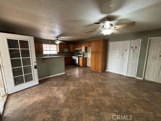 a view of a livingroom with a kitchen