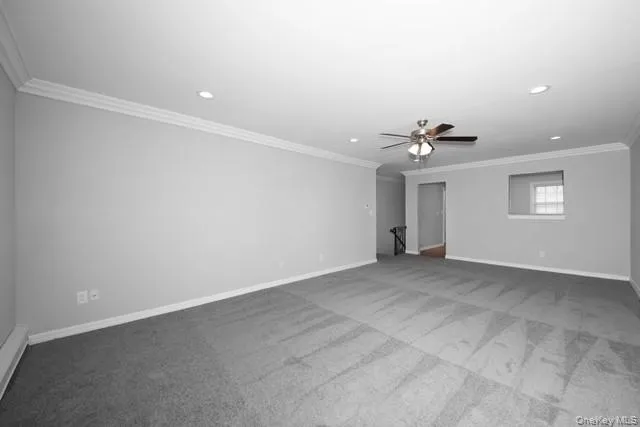 an empty room with a empty space and windows