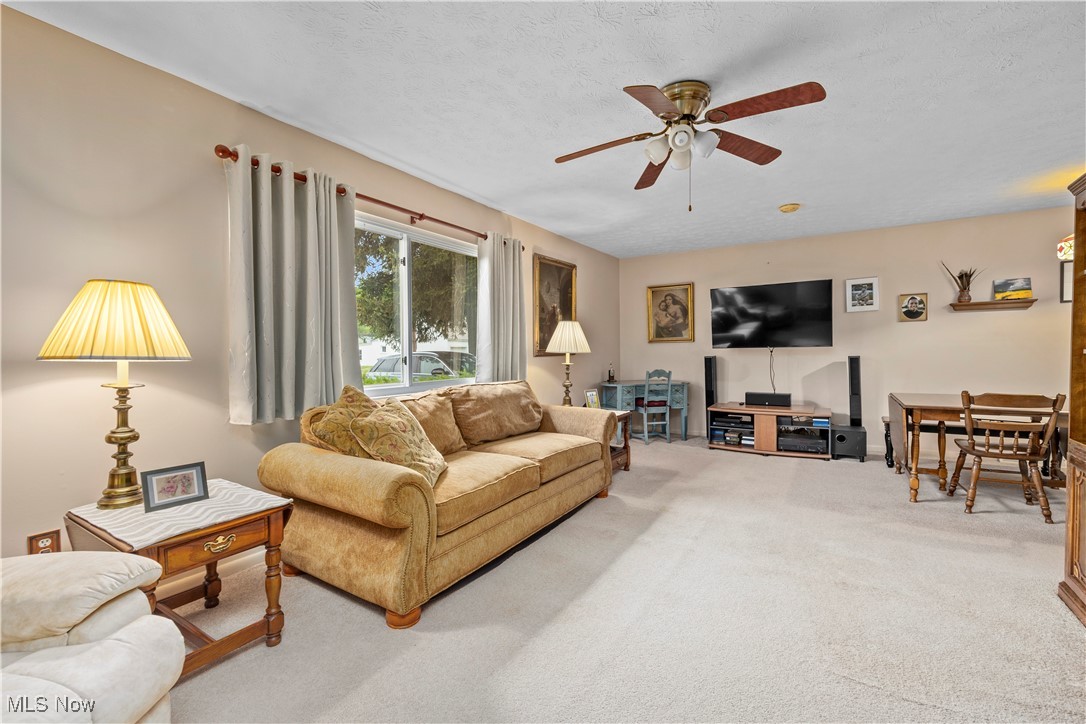 215 Sunset Road Avon Lake, OH 44012 - Photo 6 of 32 Living room featuring carpet floors and ceiling fan