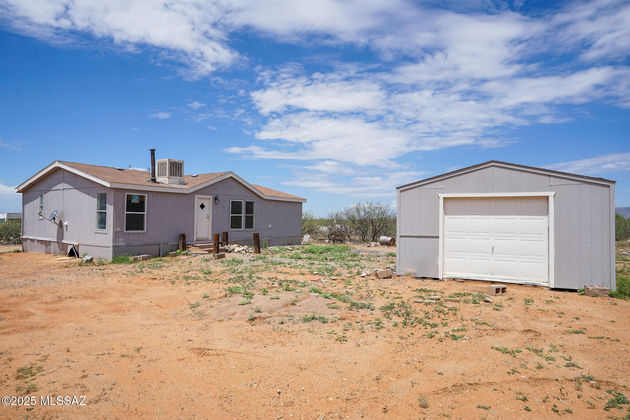 5188 East Phillips Road Willcox, AZ 85643 - Photo 32 of 43 a big house with a large tree in front of it