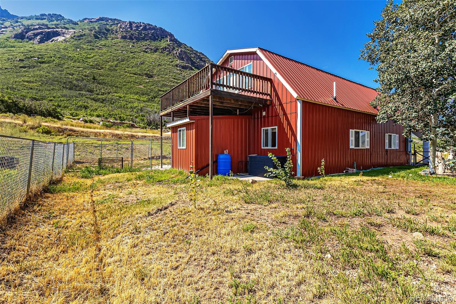 26101-246 16 1/10 Road Whitewater, CO 81527 - Photo 11 of 49 a view of a house with a yard