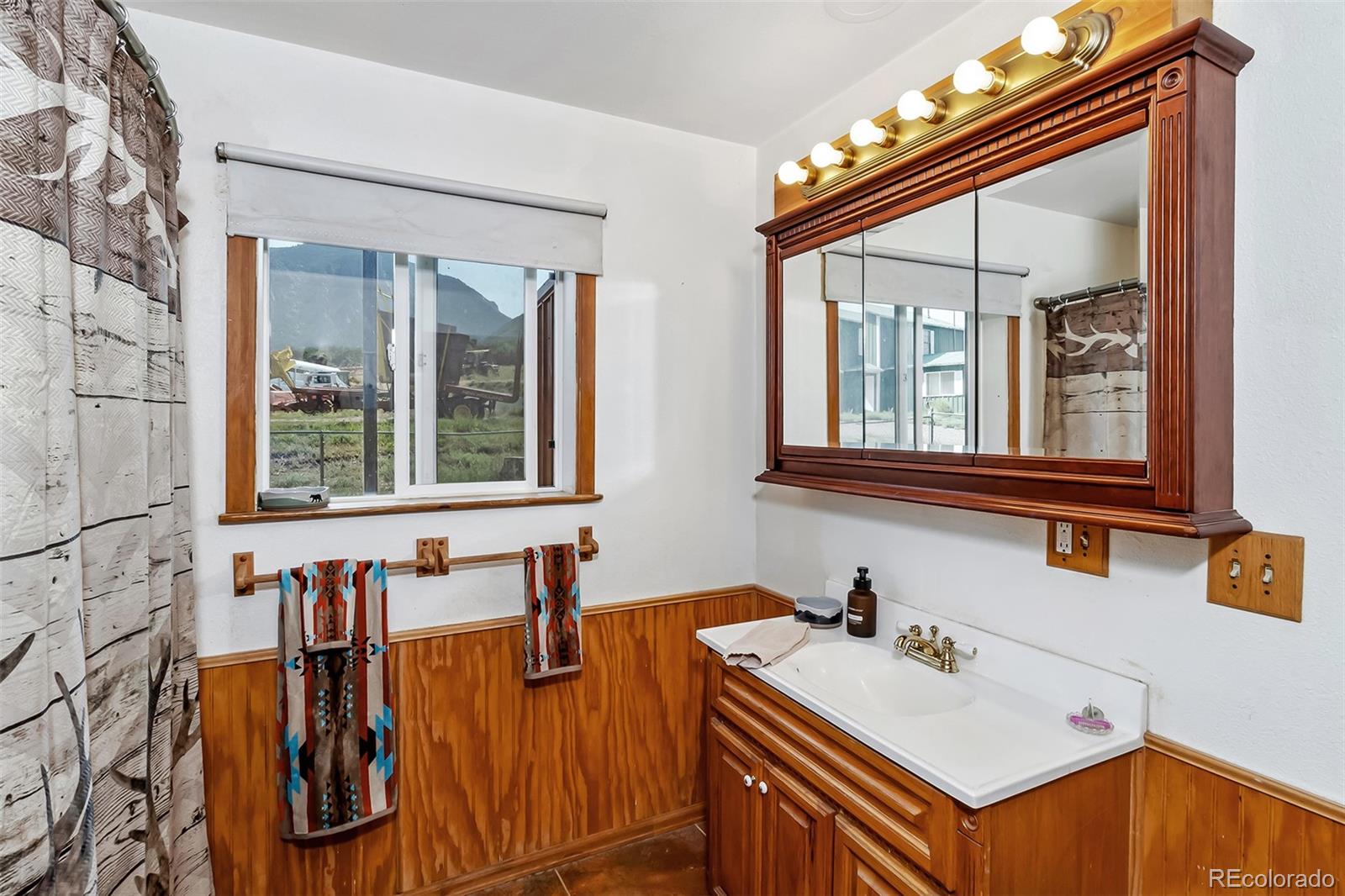 26101-246 16 1/10 Road Whitewater, CO 81527 - Photo 46 of 49 a bathroom with a sink and a mirror