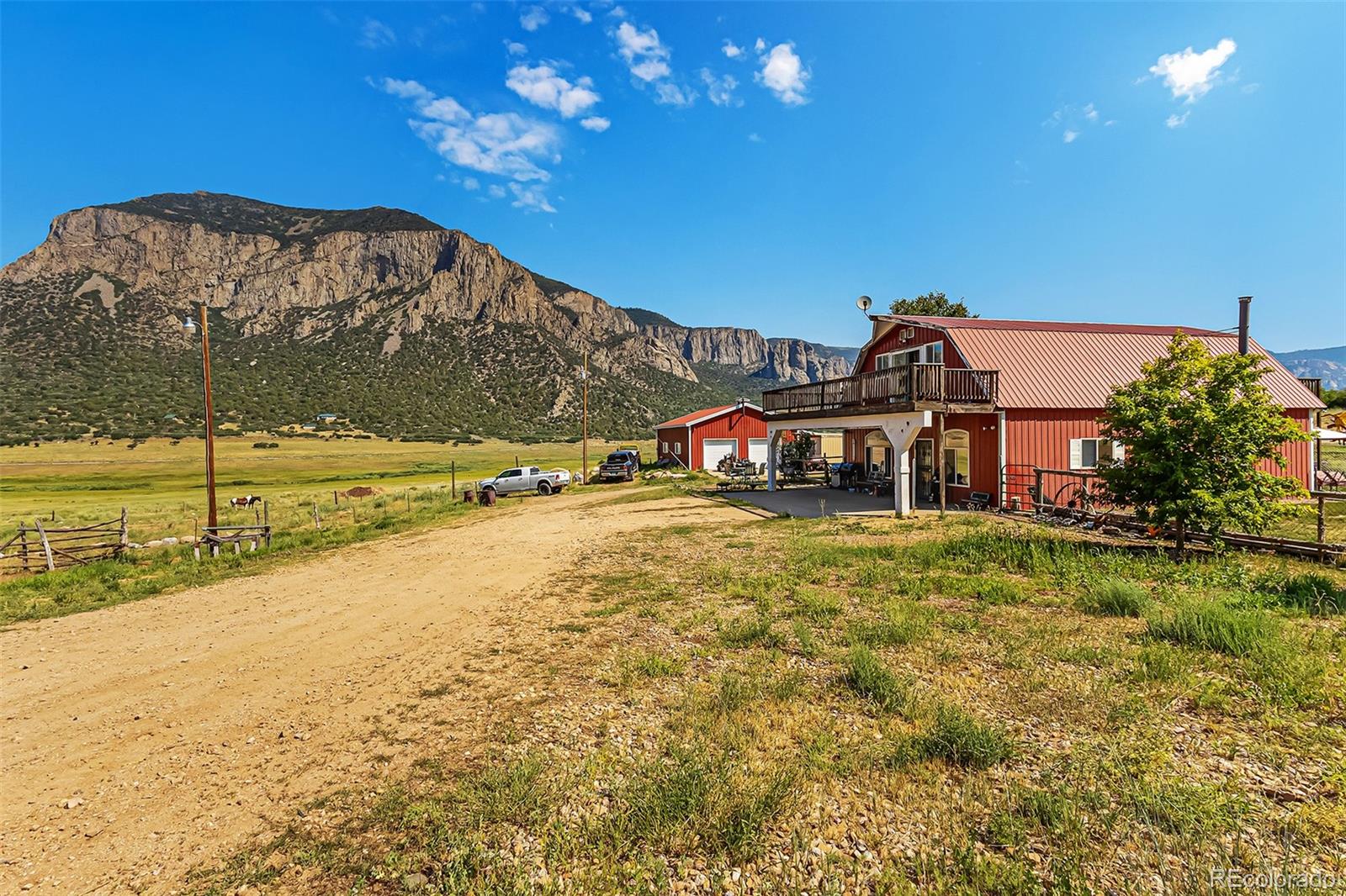 26101-246 16 1/10 Road Whitewater, CO 81527 - Photo 7 of 49 a view of a big yard next to a building