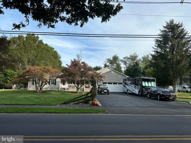 a view of multiple houses with a yard