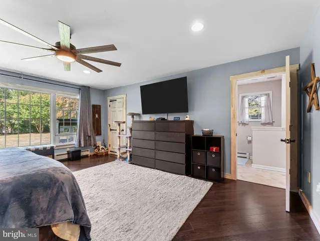 a bed room with a bed and a television