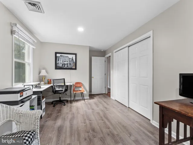 a view of a livingroom with furniture and a window