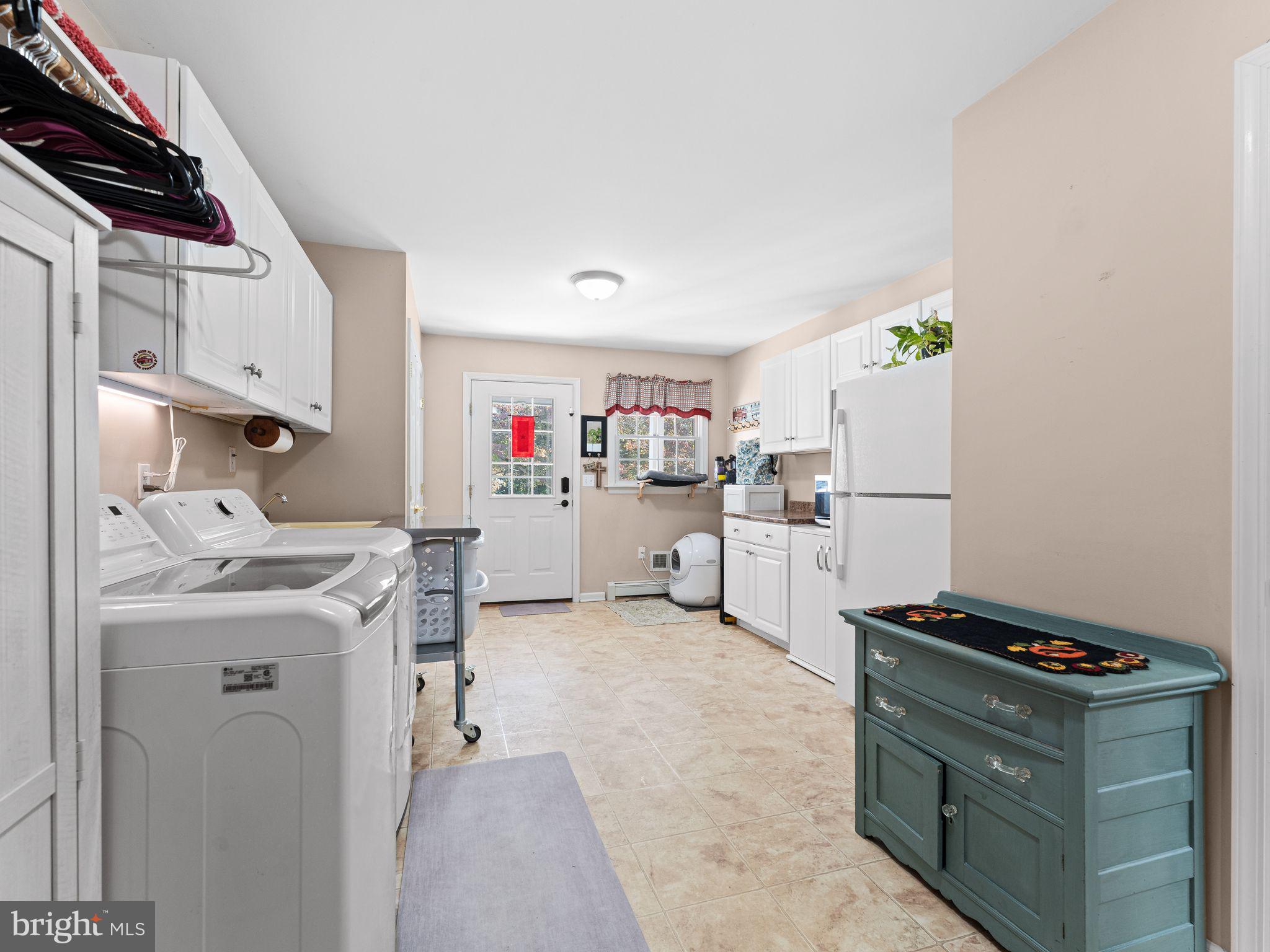 264 Edgebrook Road Robbinsville, NJ 08691 - Photo 26 of 39 a kitchen with refrigerator and cabinets