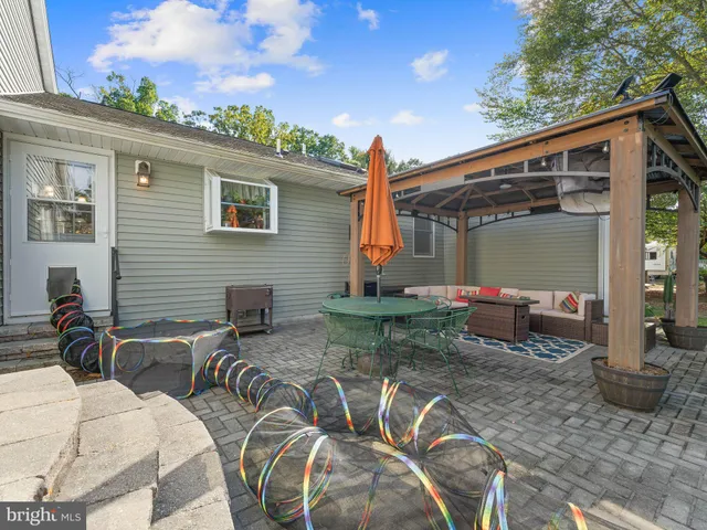 a view of backyard with outdoor seating