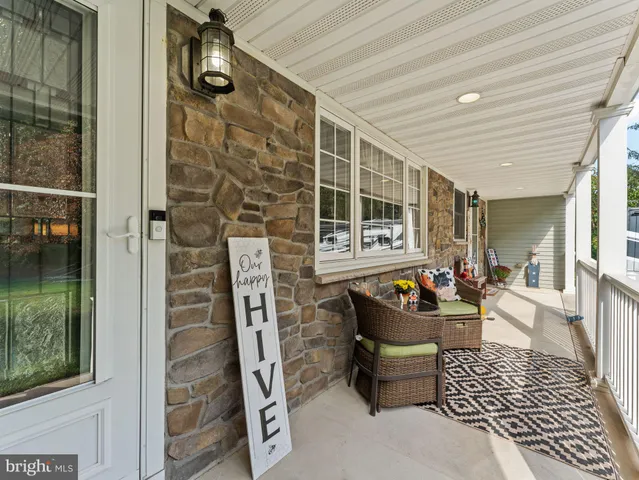 a outdoor space with patio furniture and a potted plant