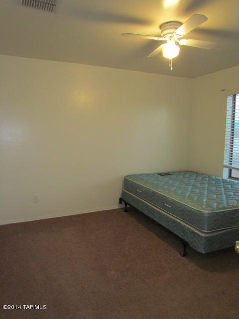 669 West Ash Ridge Drive Green Valley, AZ 85614 - Photo 13 of 17 a view of a room with air conditioner duct and empty racks