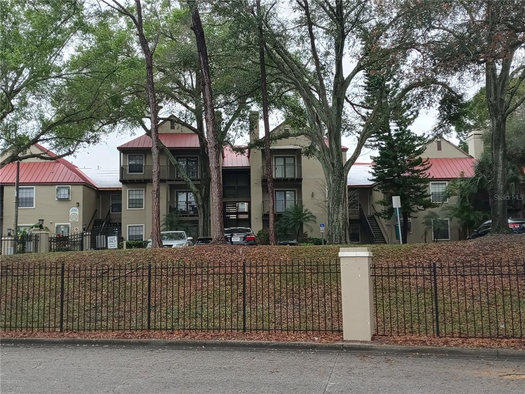 216 Afton Square, Unit 208 Altamonte Springs, FL 32714 - Photo 13 of 19 a front view of a house with a tree