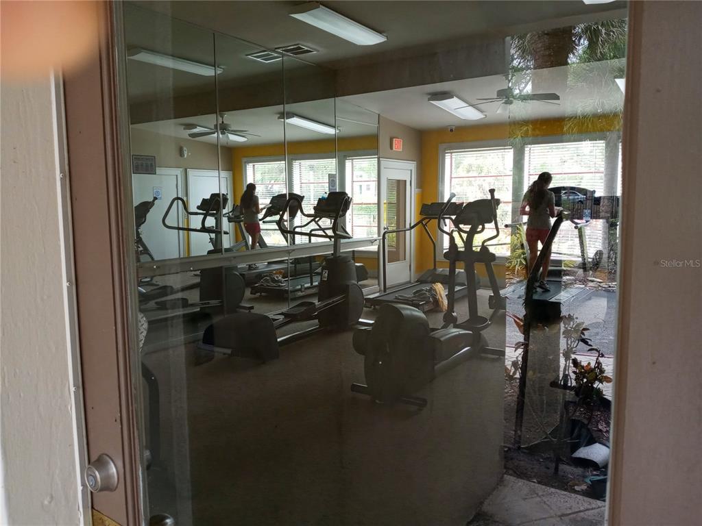 216 Afton Square, Unit 208 Altamonte Springs, FL 32714 - Photo 15 of 19 a view of a room with gym equipment
