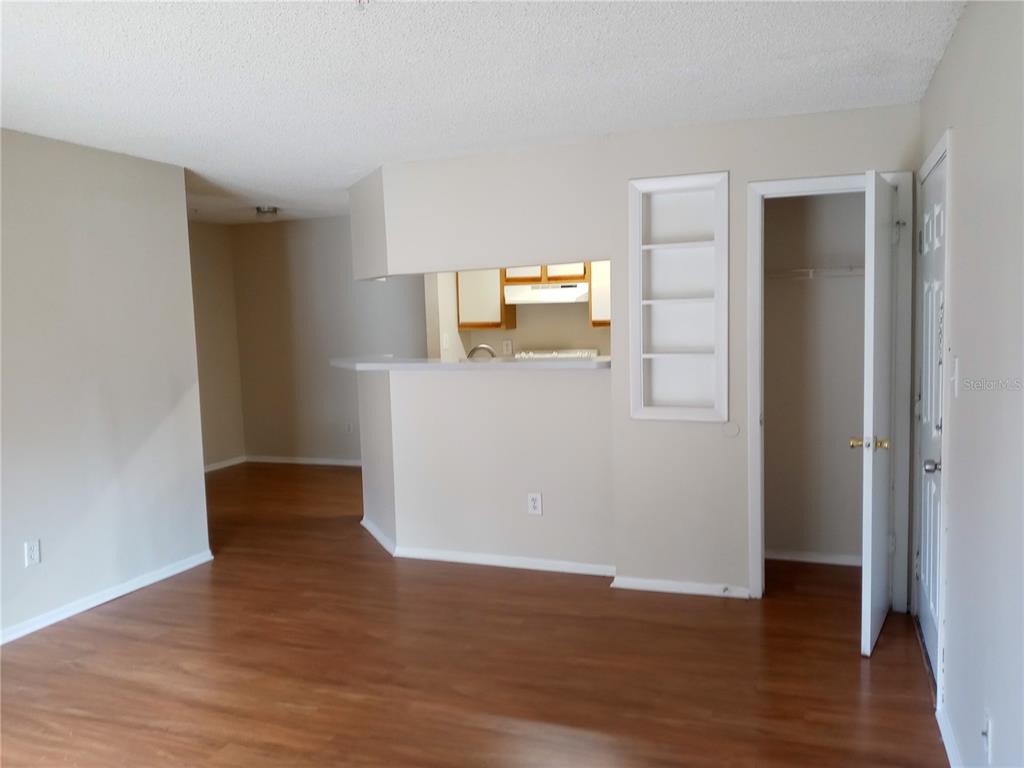 216 Afton Square, Unit 208 Altamonte Springs, FL 32714 - Photo 7 of 19 a view of empty room with wooden floor