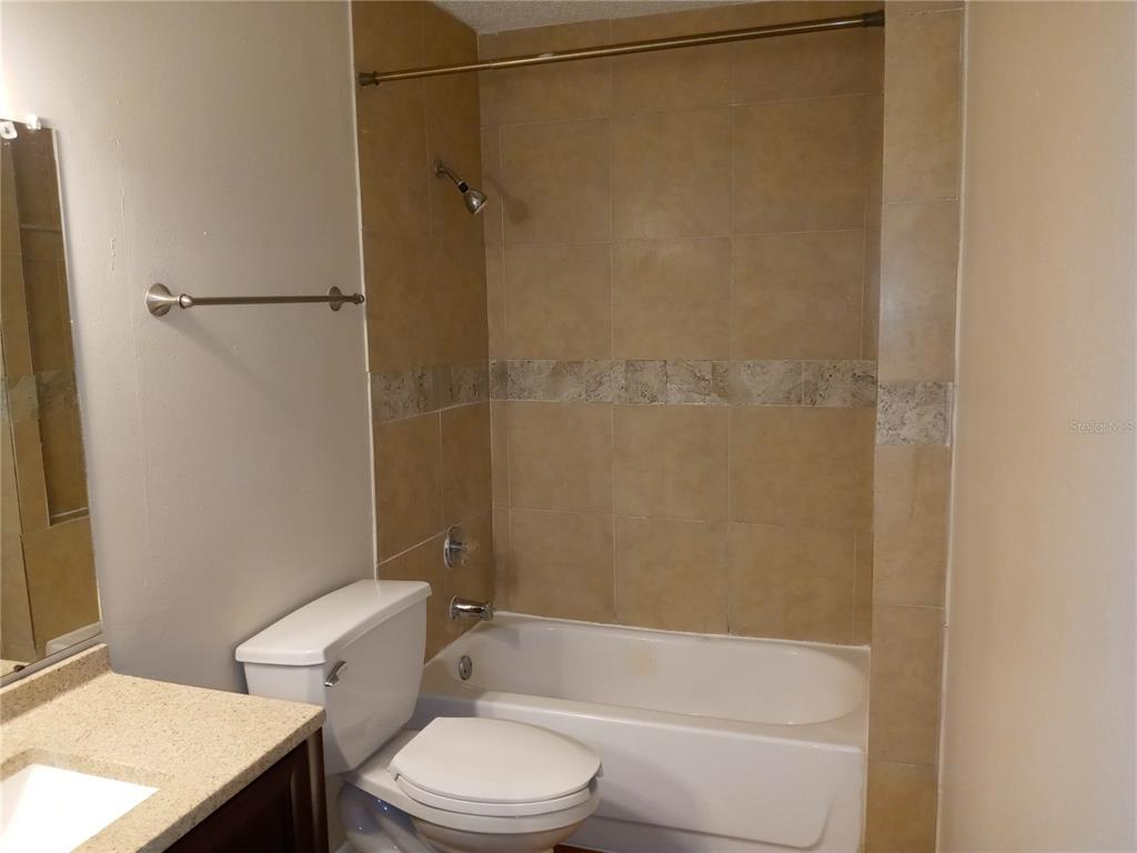 216 Afton Square, Unit 208 Altamonte Springs, FL 32714 - Photo 10 of 19 a bathroom with a toilet and a shower