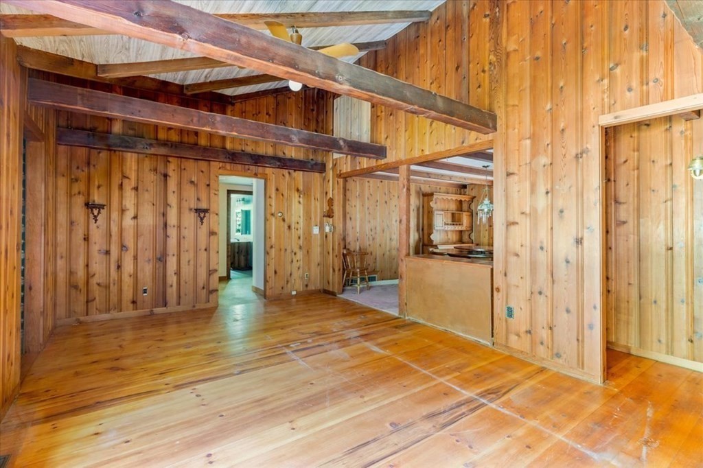 165 Summer Street Scituate, MA 02066 - Photo 12 of 22 a view of a big room with wooden floor and a door