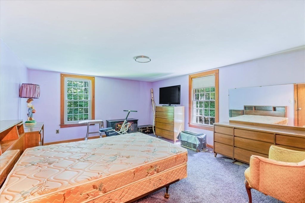 165 Summer Street Scituate, MA 02066 - Photo 17 of 22 a bed room with a bed window and flat screen tv