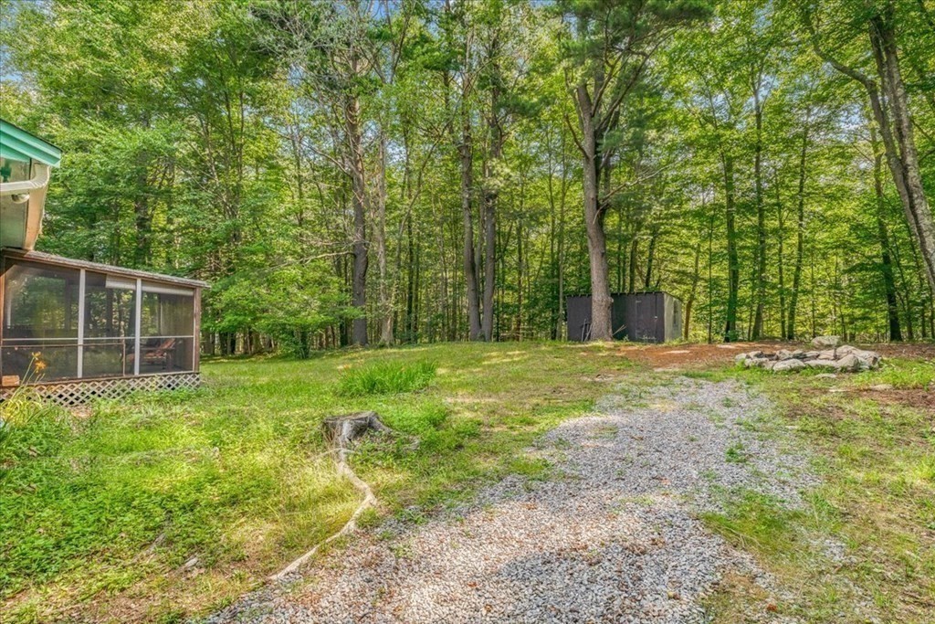 165 Summer Street Scituate, MA 02066 - Photo 6 of 22 a view of a backyard with large trees