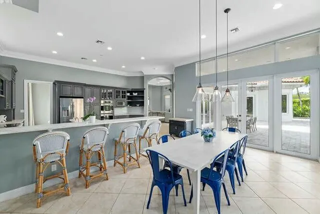 a living room with furniture tv and a large window
