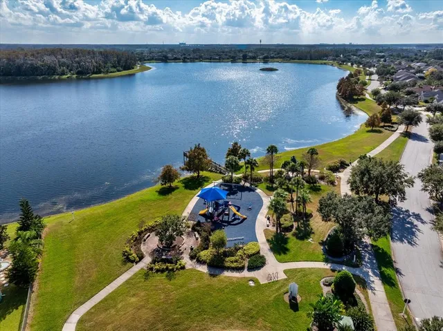 a view of a balcony with wooden floor and lake view