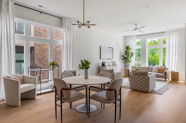 a dining room with furniture window wooden floor