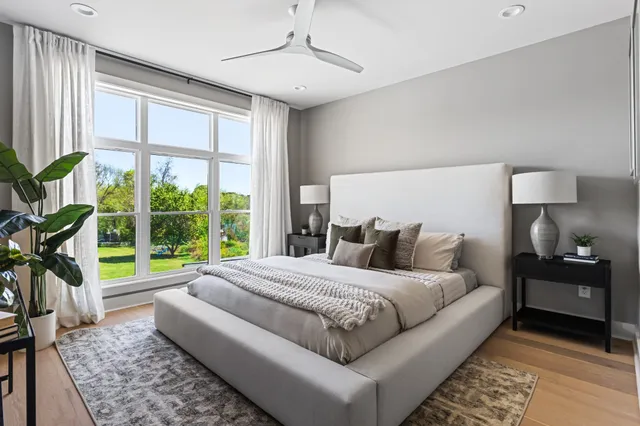 a bedroom with a bed and a lamp