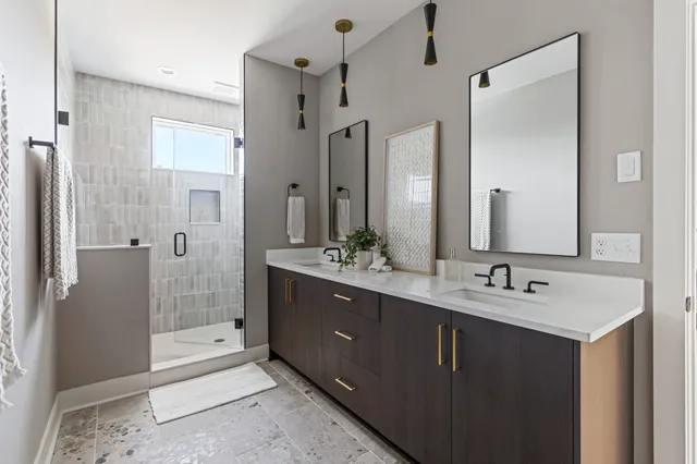 a bathroom with a shower and a sink
