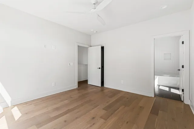 a en suite bathroom with a sink double vanity and mirror