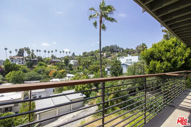 a view of a balcony with an outdoor space