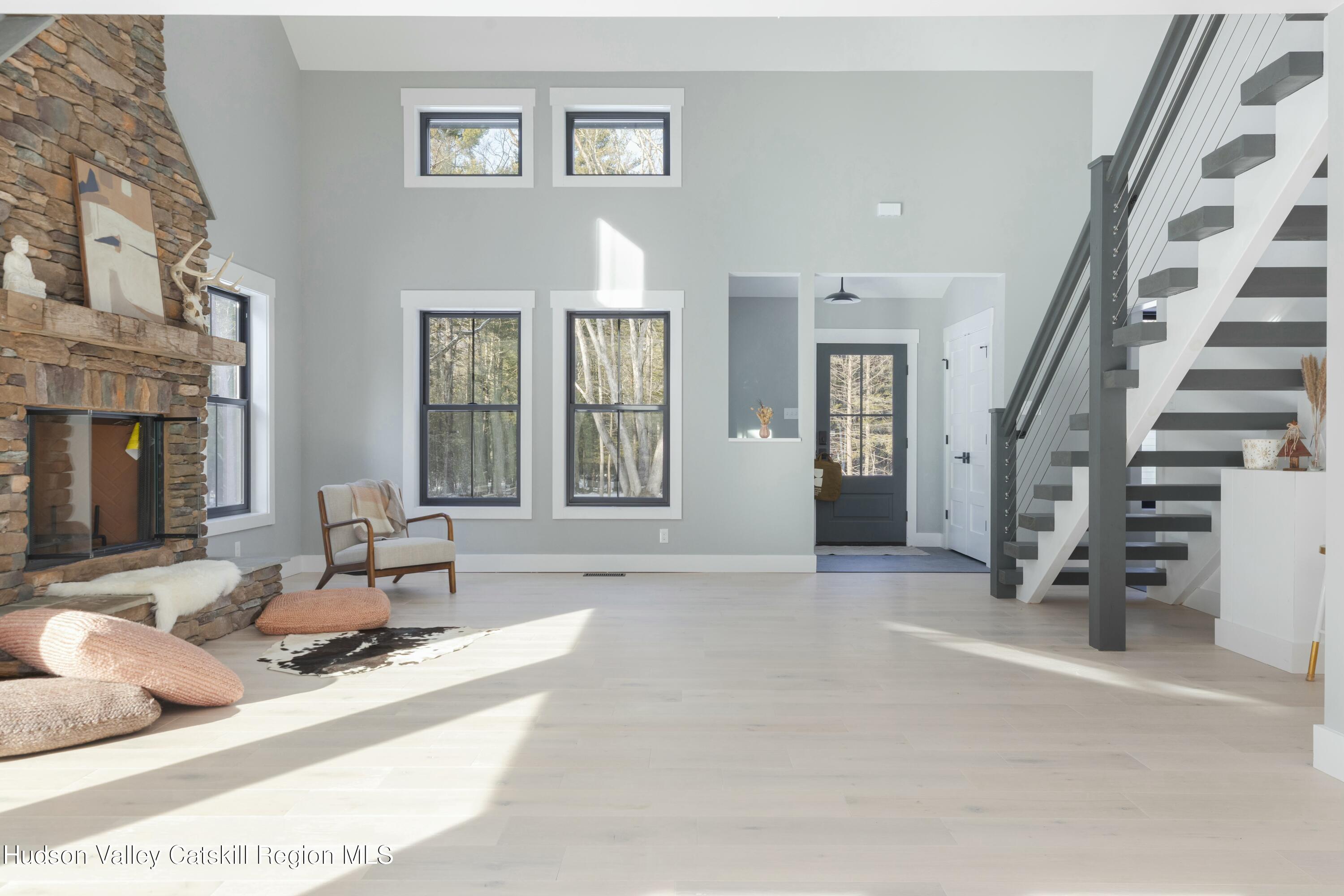 34 Tetta Lane Olivebridge, NY 12461 - Photo 11 of 35 a living room with furniture and stairs