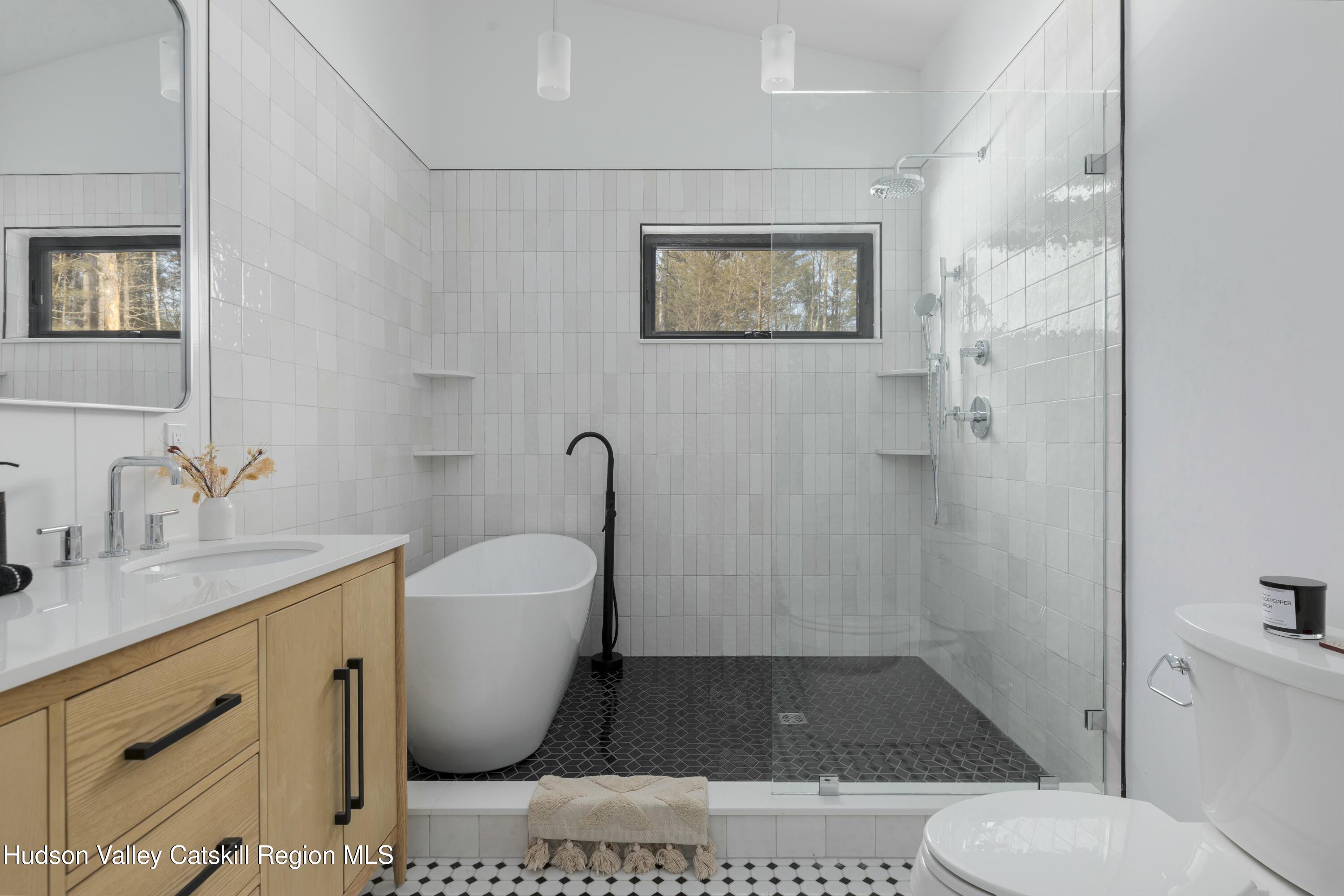 34 Tetta Lane Olivebridge, NY 12461 - Photo 24 of 35 a bathroom with a toilet sink and shower