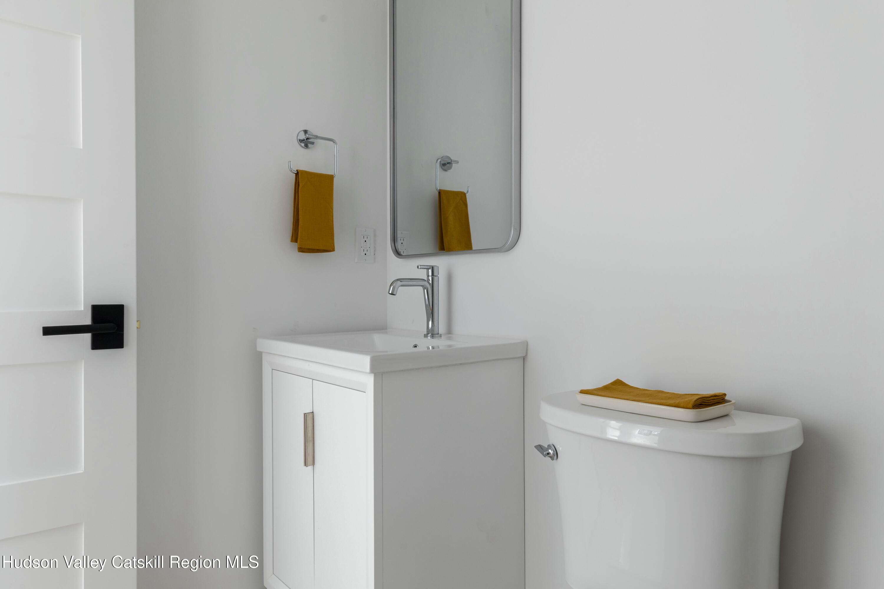 34 Tetta Lane Olivebridge, NY 12461 - Photo 25 of 35 a bathroom with a sink and a mirror