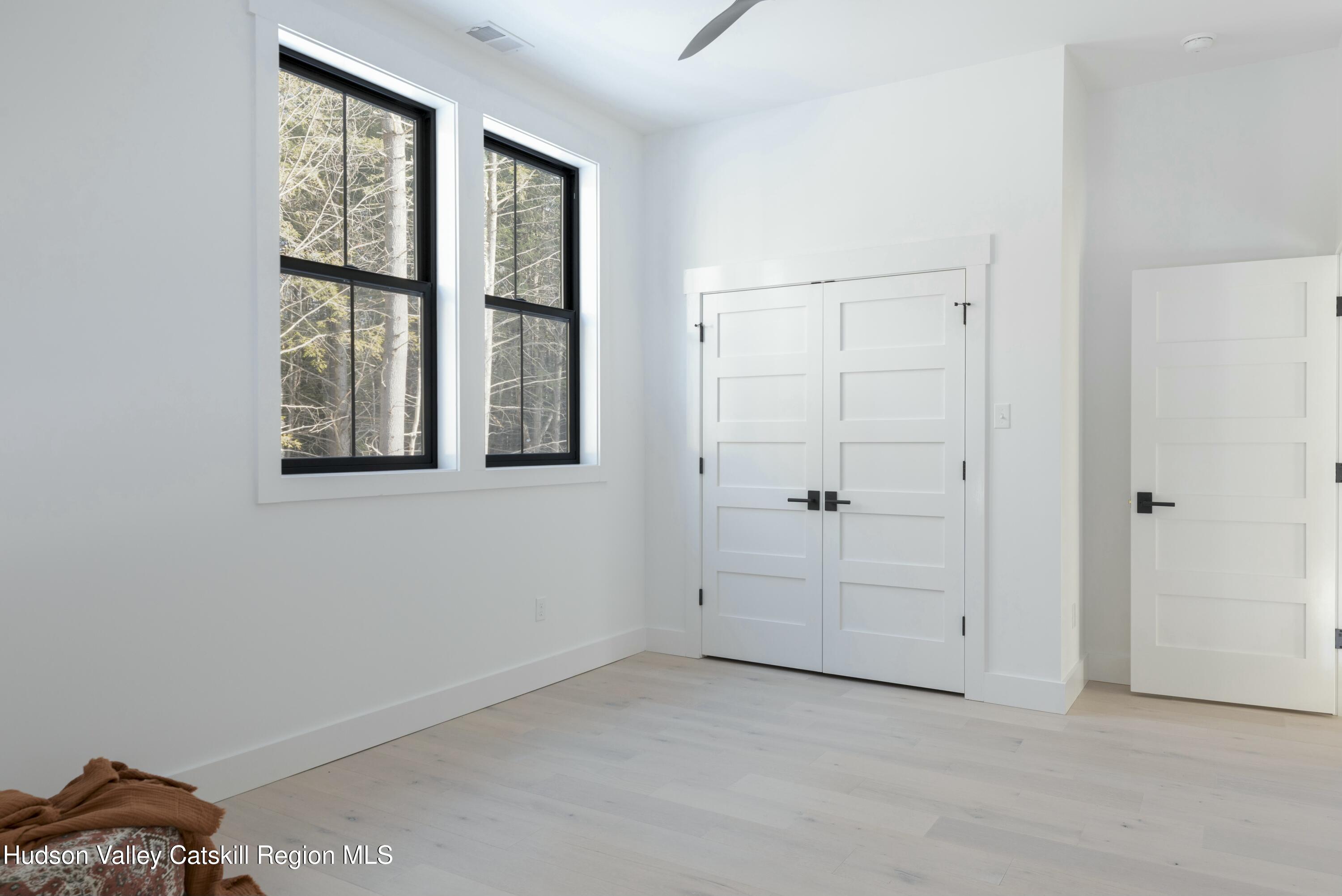 34 Tetta Lane Olivebridge, NY 12461 - Photo 27 of 35 an empty room with windows and closet