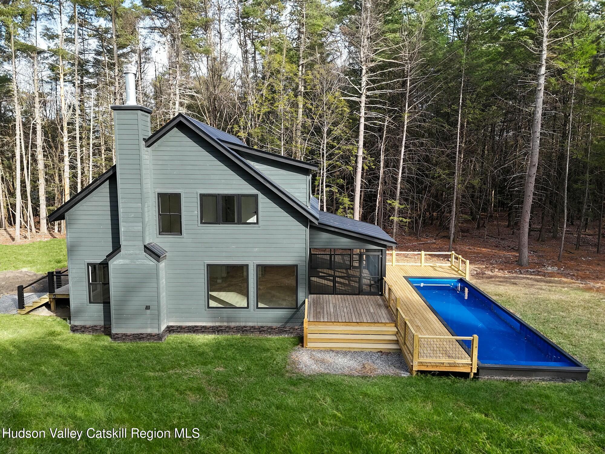 34 Tetta Lane Olivebridge, NY 12461 - Photo 32 of 35 a view of a house with backyard and a garden