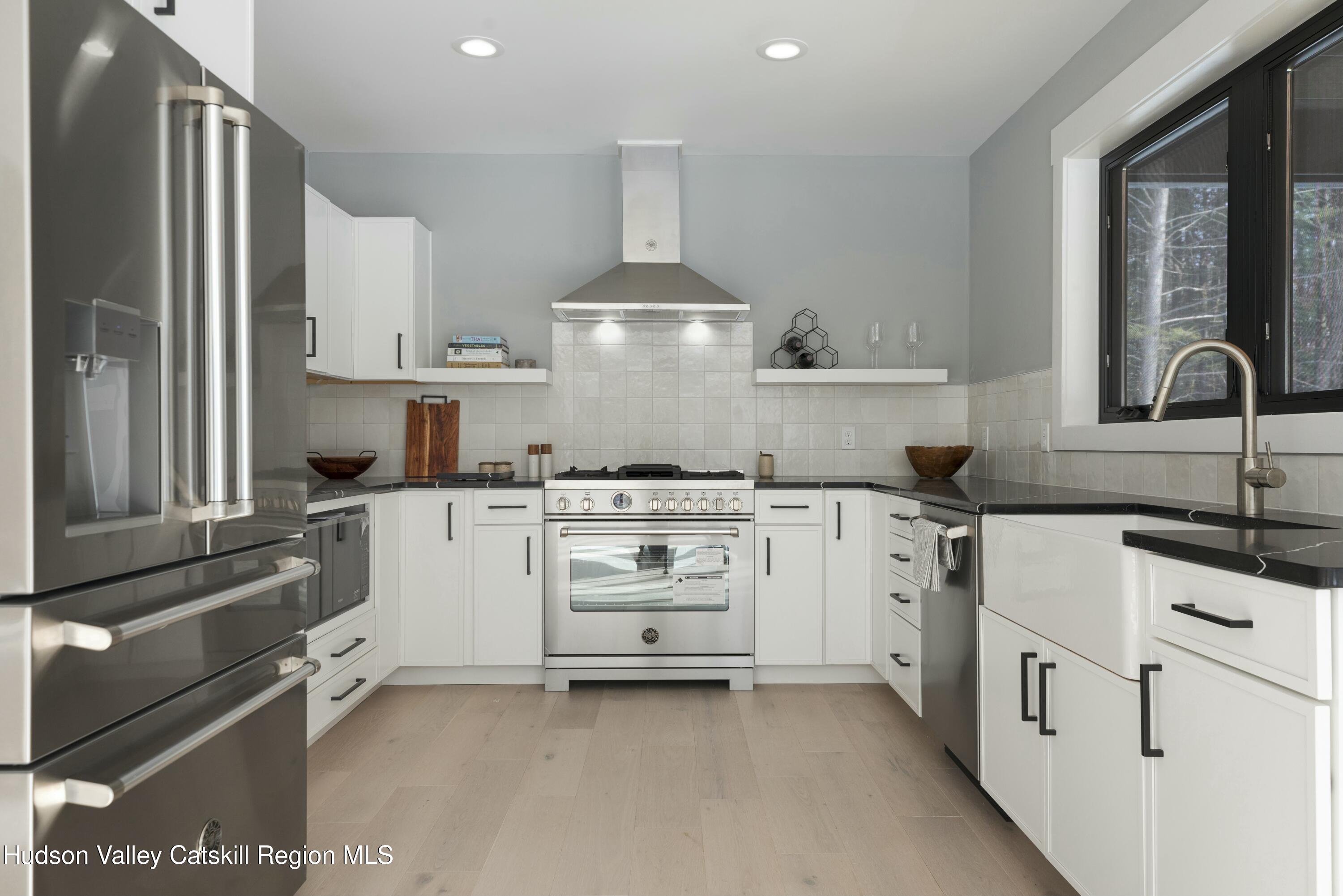34 Tetta Lane Olivebridge, NY 12461 - Photo 6 of 35 a kitchen with white cabinets and white appliances