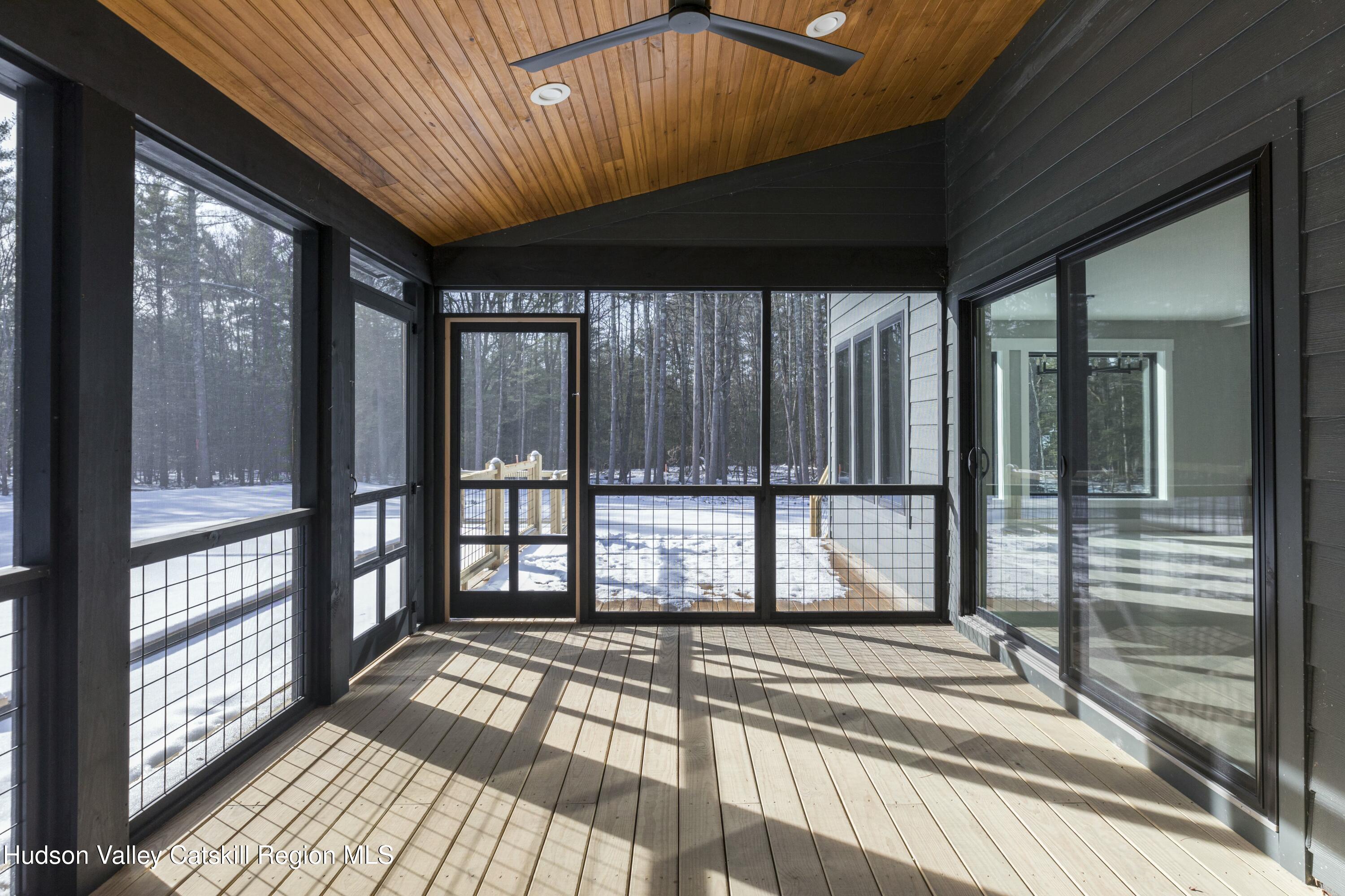 34 Tetta Lane Olivebridge, NY 12461 - Photo 7 of 35 a view of a room with wooden floor and windows