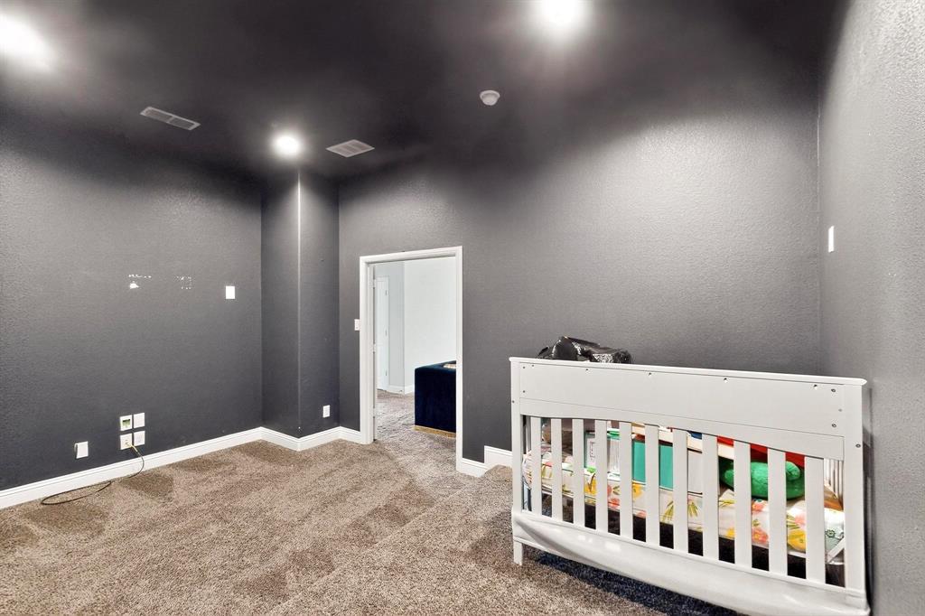 2549 Boot Jack Road Fort Worth, TX 76177 - Photo 13 of 13 Carpeted bedroom with a textured wall and a nursery area