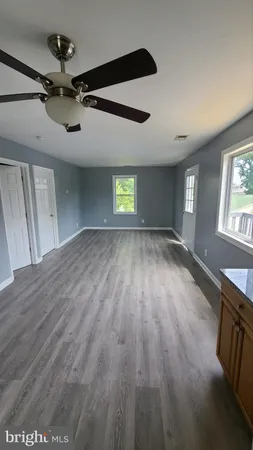 a view of an empty room and a window