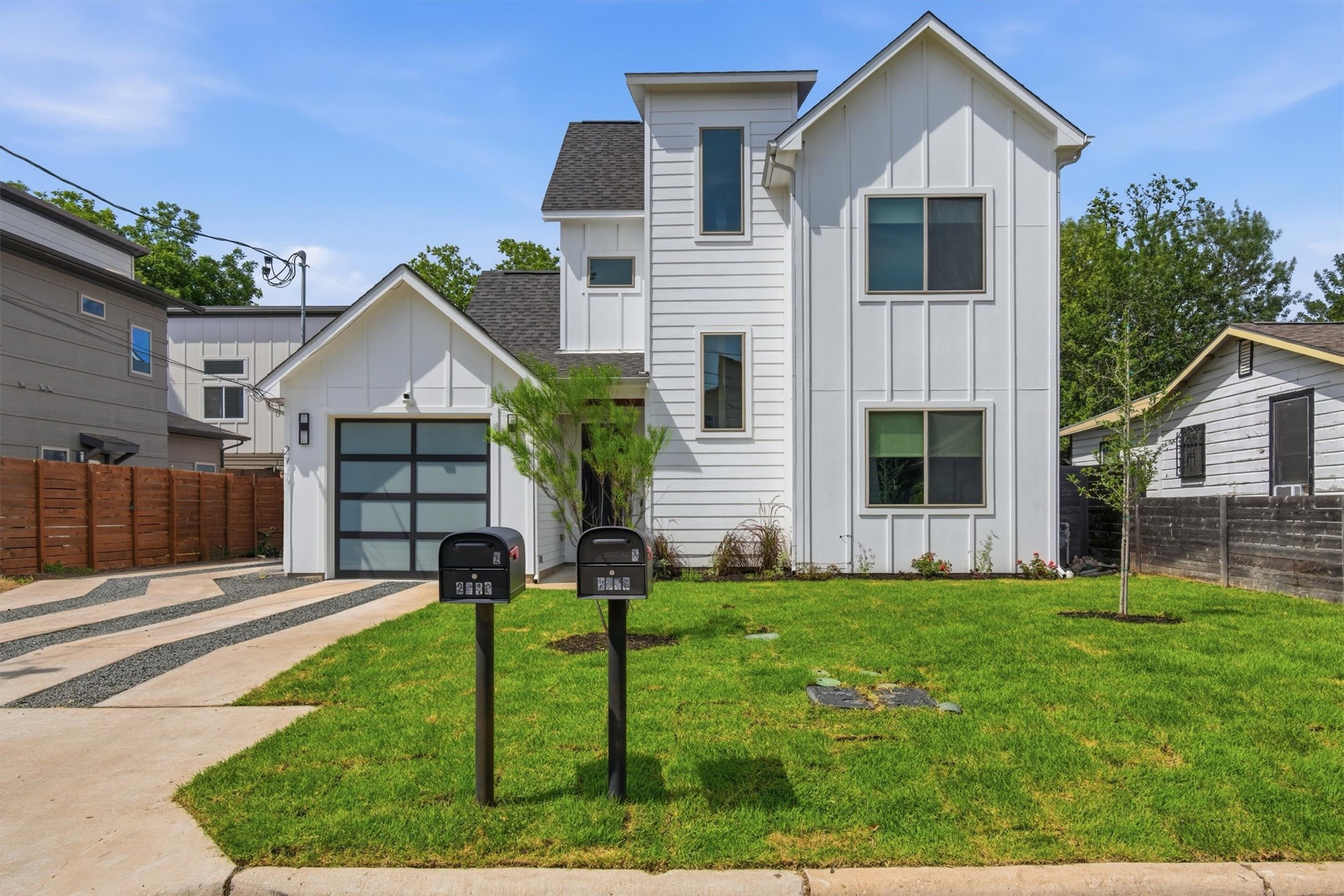 2710 Zaragosa Street, Unit A Austin, TX 78702 - Photo 2 of 29 Striking modern East Austin exterior with crisp board-and-batten siding, attached garage, and fresh front-yard landscaping on a quiet Govalle street.