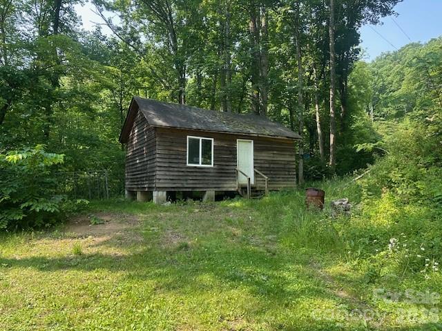 10 Chigger Ridge Road Sylva, NC 28779 - Photo 17 of 22 a backyard of a house with lots of green space