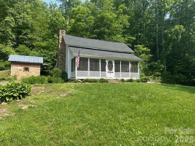 10 Chigger Ridge Road Sylva, NC 28779 - Photo 20 of 22 a view of a house with yard and sitting area