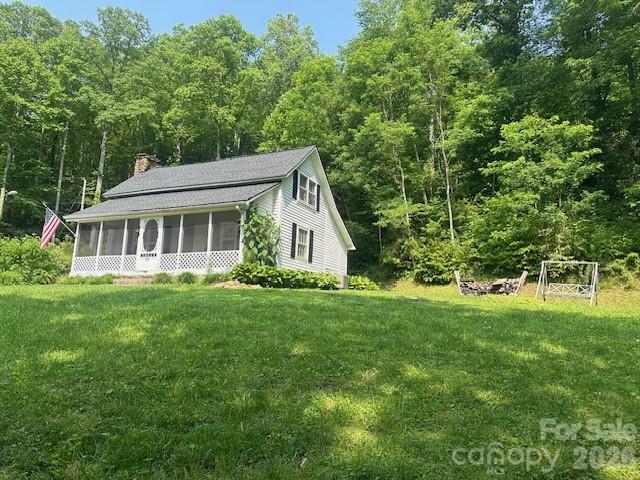 10 Chigger Ridge Road Sylva, NC 28779 - Photo 21 of 22 a view of a house with backyard and garden