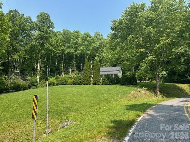 10 Chigger Ridge Road Sylva, NC 28779 - Photo 22 of 22 a view of a chair and table on the green field