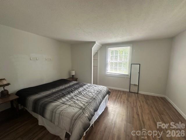 10 Chigger Ridge Road Sylva, NC 28779 - Photo 7 of 22 a bed sitting in a bedroom next to a window