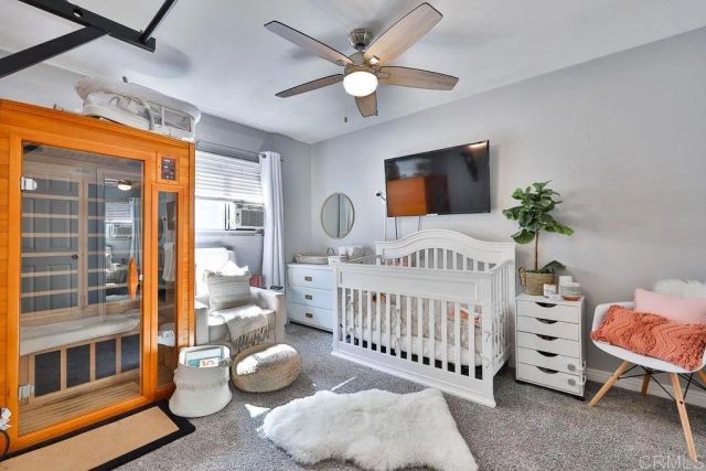 a bedroom with furniture and a window