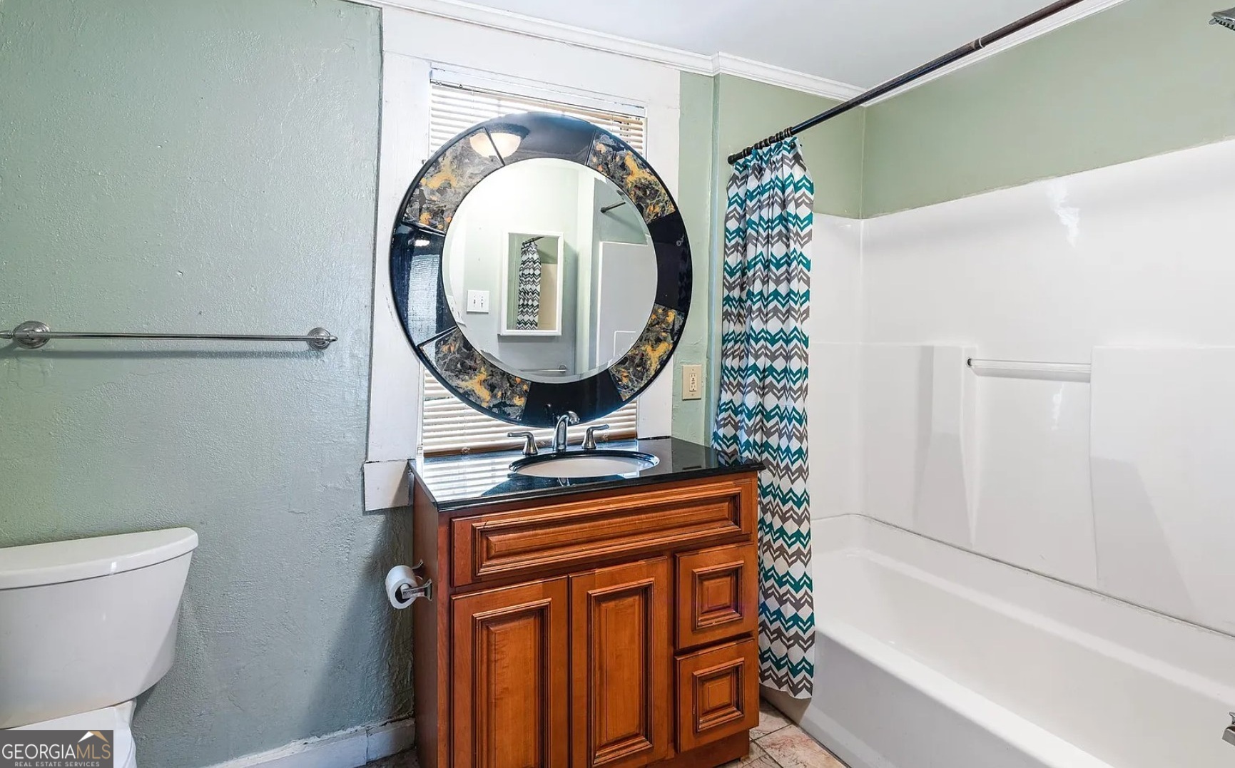 1143 United Avenue Southeast, Unit B Atlanta, GA 30316 - Photo 5 of 17 a bathroom with a toilet a sink and a mirror