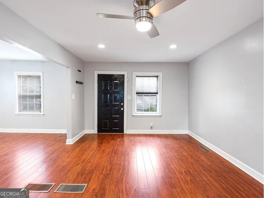 1143 United Avenue Southeast, Unit B Atlanta, GA 30316 - Photo 8 of 17 a view of an empty room with wooden floor and a window