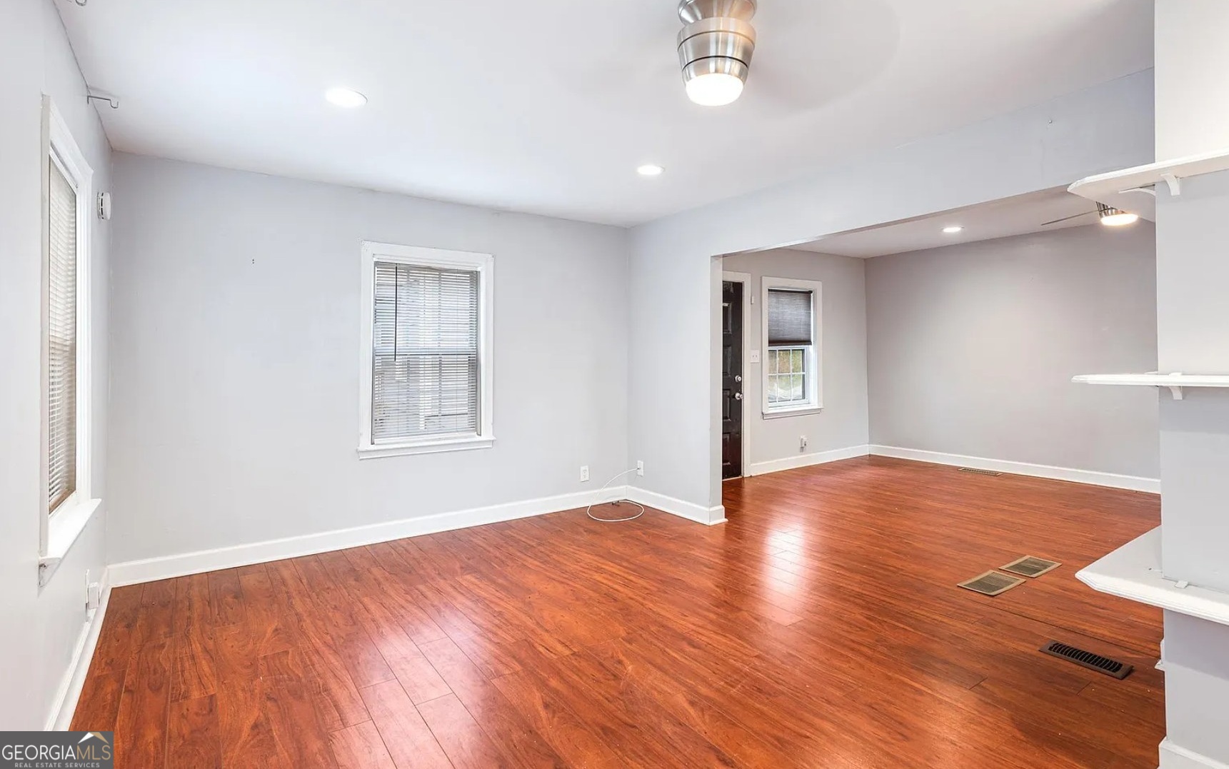 1143 United Avenue Southeast, Unit B Atlanta, GA 30316 - Photo 10 of 17 an empty room with wooden floor and windows